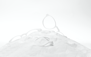3D printed glasses in white powder